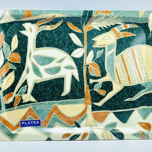 May include: A rectangular serving tray with a green, white, and orange geometric pattern featuring stylized animals. The tray has a white border and the text "PLATEX" in blue.