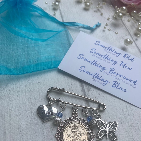 Something old, something new, something borrowed, something blue pin for garter, dress or bouquet. Including lucky sixpence