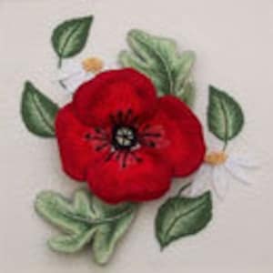 May include: A close-up of a handcrafted floral design featuring a vibrant red poppy as the focal point. The poppy is surrounded by green leaves and white daisies, all set against a cream-colored background. The design showcases detailed embroidery work.