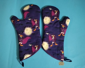 Terror flaps in the the Night Oven Mitt; gift kitchen accessory linen 90s duck cartoon baking cooking purple housewarming