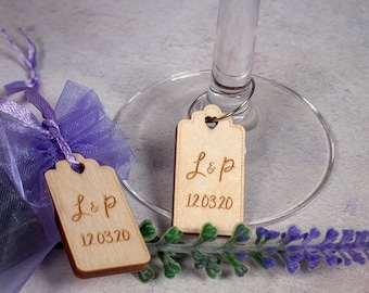 Personalised wooden tag charm wedding favours for a romantic travel themed wedding, adventure is out there