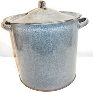 May include: A large, gray enamel pot with two handles and a lid. The pot has a speckled, mottled finish.