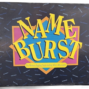 May include: A game box with a black background and colorful text that reads "NAME BURST" in large, bold letters. The text "The Memory-Jogging, Name-Calling, Who's Who Game!" is printed below the title. The box is filled with names of famous people in white text.