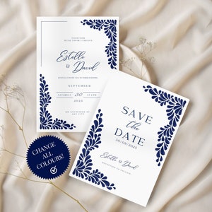 Könnte beinhalten: Zwei weiße Hochzeitseinladungskarten mit marineblauen floralen Designs. Die obere Karte lautet "Gemeinsam mit ihren Familien Estelle & David" und die untere Karte lautet "Save the Date 30/09/2025 Estelle & David".