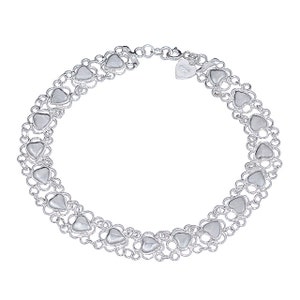 May include: Silver bracelet with a double row of heart-shaped links. The bracelet has a lobster clasp and a small heart-shaped tag with the inscription "925".