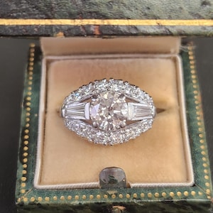 Vintage Mid-Century Round Brilliant Cut and Baguette Diamond Engagement Ring in Platinum