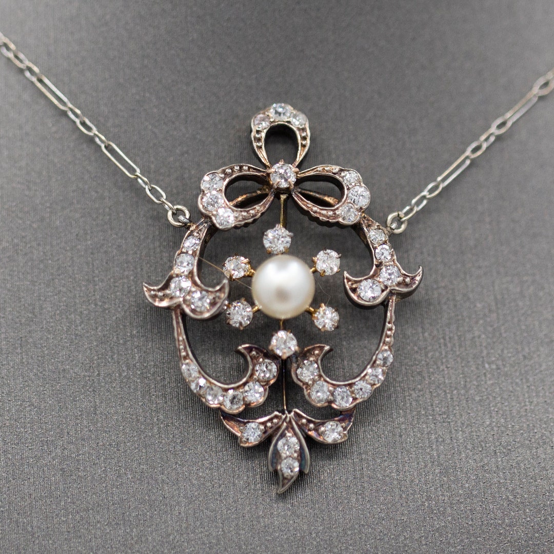 Exquisite Edwardian Natural Pearl and Diamond Bow Necklace in 14k White and Yellow Gold