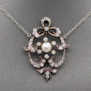 Exquisite Edwardian Natural Pearl and Diamond Bow Necklace in 14k White and Yellow Gold