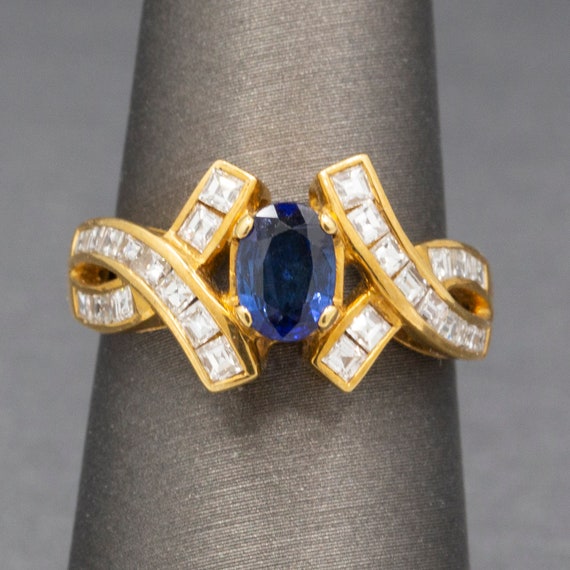 Sparkling Oval Cut Blue Sapphire and French Cut Ca