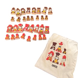 May include: A wooden chess set featuring cartoon character chess pieces in red and brown. The set includes a drawstring bag with chess piece illustrations and the word "CHESS".