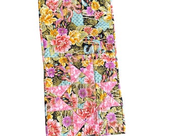 Estuche plegable acolchado con diseño floral de patchwork y bolsillo