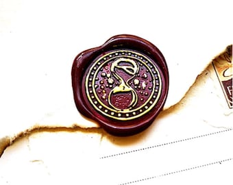 Seal with an hourglass to make an hourglass wax stamp on artisanal creation, envelope, snail mail ...