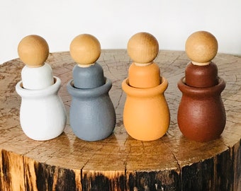 wooden peg dolls in cups