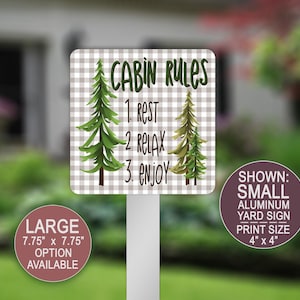May include: A square aluminum yard sign with a light gray and white gingham background. The text reads CABIN RULES followed by 1. REST, 2. RELAX, 3. ENJOY. Two green pine trees flank the text. A label indicates a 4 inch by 4 inch print size.