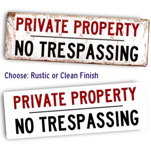 May include: Two signs with the text "PRIVATE PROPERTY NO TRESPASSING" in red and black lettering. The top sign has a rustic wood background and the bottom sign has a clean white background.