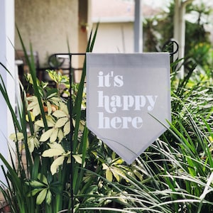 It’s Happy Here Garden Flag
