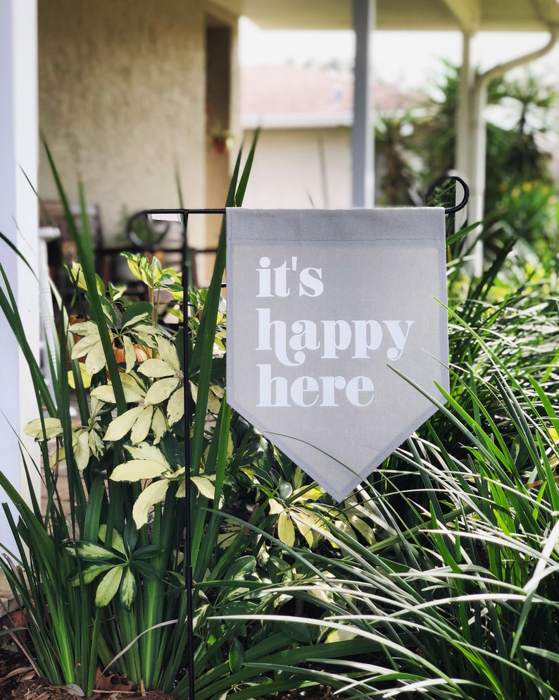 It’s Happy Here Garden Flag