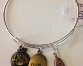 R.I.P. Expandable Bangle Bracelet with Charms,Antique Brass Jack-o-lantern, Antique Gold R.I.P. Tombstone, and Antique Copper Ghost