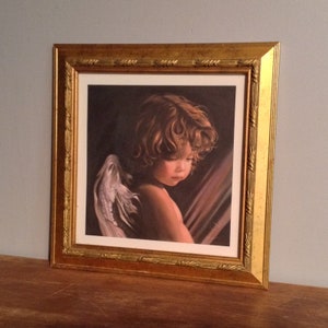 Nancy Noel&#39;s Angel Looking Down Framed Print with Embossed Registered Certificate
