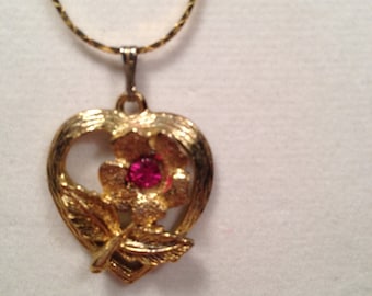 Gold Tone Open Work Heart Pendant With Central Flower and Faceted Red Rhinestone, Fine Gold Tone Snake Chain, Pretty for a Young Girl.