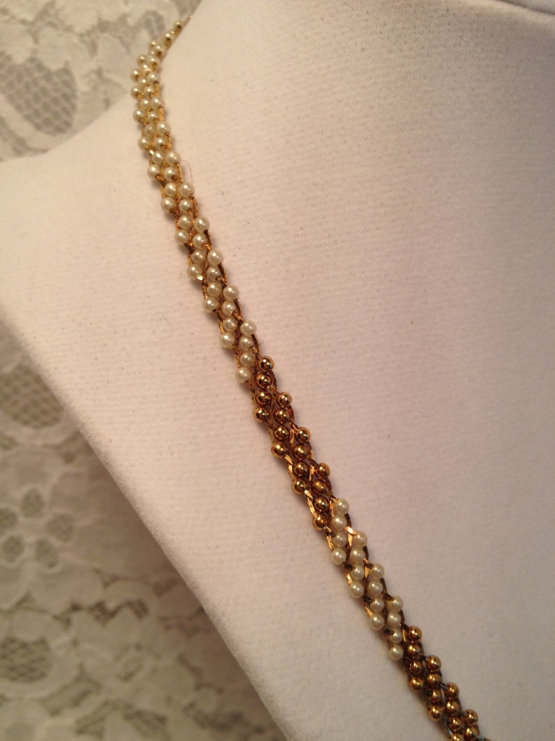 Citation Faux Pearl and Gold Bead Necklace on Gold Tone Mesh Background Ombre Effect.
