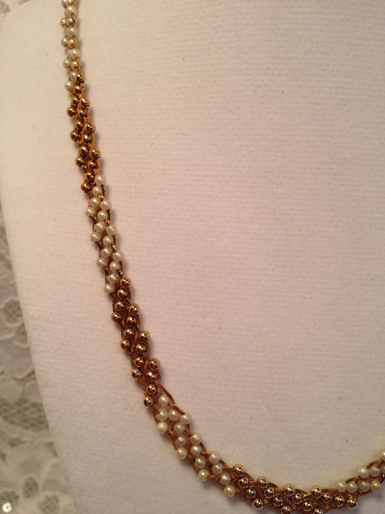 Citation Faux Pearl and Gold Bead Necklace on Gold Tone Mesh Background Ombre Effect.