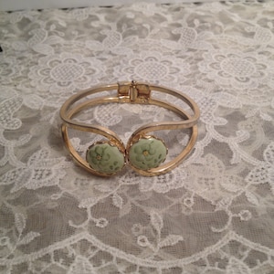 Gold Toned Hinged Cuff Bracelet, One Size Fits All, Green Cameo-like Center with Green Flowers.  Very Dainty.