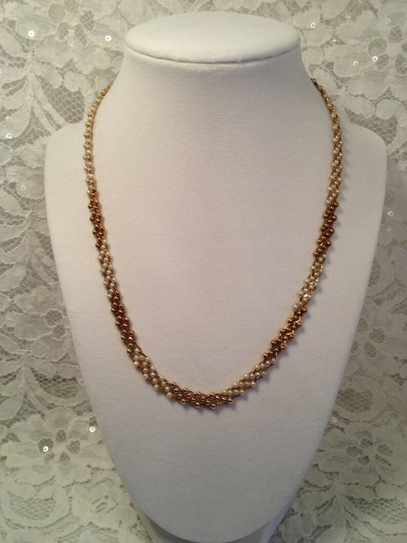 Citation Faux Pearl and Gold Bead Necklace on Gold Tone Mesh Background Ombre Effect.