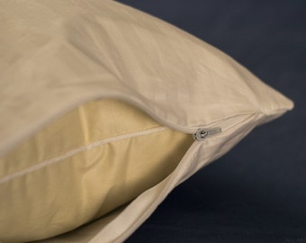 May include: A white pillowcase with a zipper closure. The pillowcase is made of a soft, breathable fabric and is designed to protect your pillow from dust mites and other allergens.