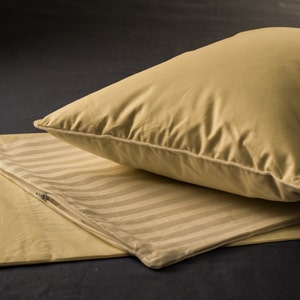 DOWN Travel Pillow Set - Cream:  (12"x16") 700-fill power goose down travel pillow, pillow protector and a 100% cotton cream pillowcase.