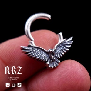 A highly detailed, Gothic crow / raven shaped clicker septum ring, made from solid Sterling silver, by RBZ Jewelry, open mode.