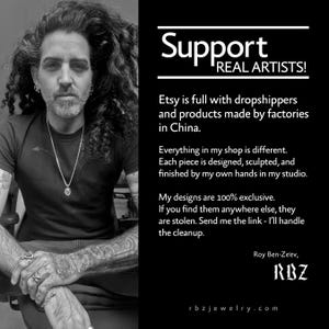 May include: A black and white image featuring a man with long curly hair and tattoos, alongside text that reads "Support REAL ARTISTS!" and details about handmade jewelry. The text emphasizes the exclusivity of the designs and the artist's commitment to craftsmanship.