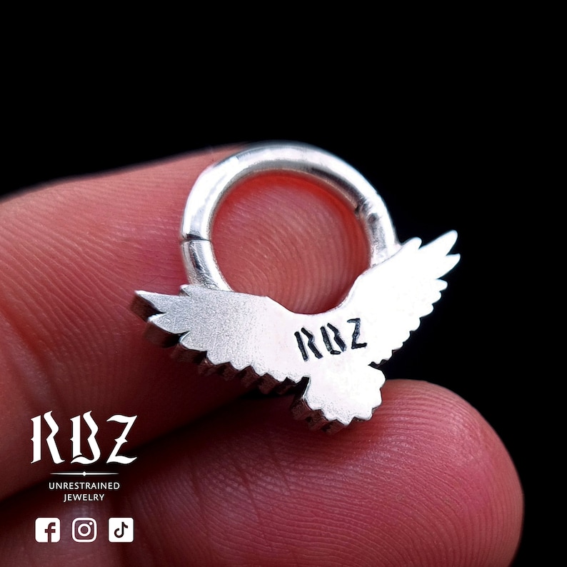 A highly detailed, Gothic crow / raven shaped clicker septum ring, made from solid Sterling silver, by RBZ Jewelry, back side closed mode.