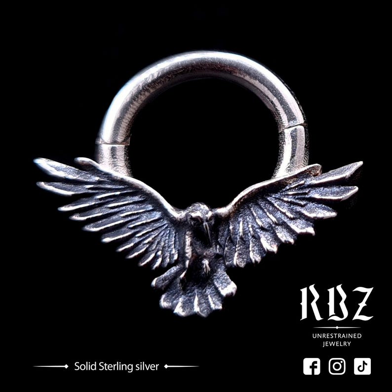 A highly detailed, Gothic crow / raven shaped, seamless clicker septum ring, made from solid Sterling silver (or gold), by RBZ Jewelry.