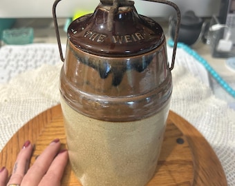 Antique THE WEIR kitchen canning crock with wire ball closure.