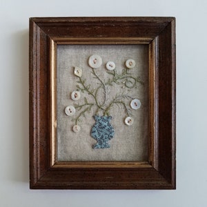 Framed linen and vintage button hand-stitched floral textile collage