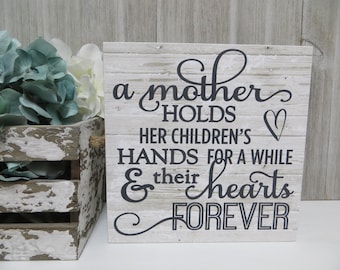 A Mother holds her children/'s hands for a short while but their hearts forever,mom,Mothers Day,holding hearts of children,mother child love