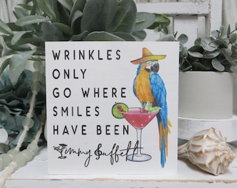 Beach Parrot Sign: Wrinkles only go Where Smiles have been - Jimmy Buffett Quote