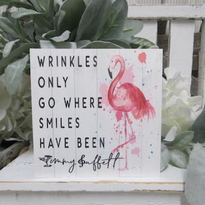 Flamingo Beach Sign: Wrinkles Only Go Where Smiles Have Been - Jimmy Buffett Quote