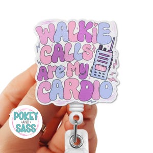 May include: A white badge reel featuring a die-cut sticker with the text WALKIE CALLS ARE MY CARDIO in wavy pink, purple, and blue lettering. The design includes a small illustration of a two-way radio and several lightning bolt accents.