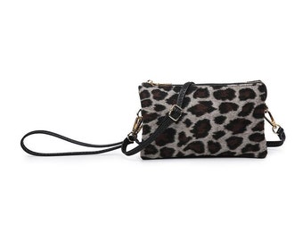 May include: A small leopard print crossbody bag with a black adjustable strap and gold hardware.
