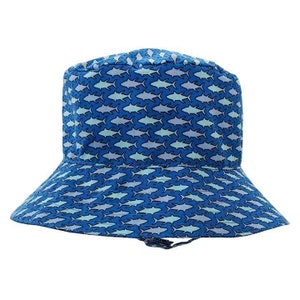 May include: A blue bucket hat with a pattern of light blue fish on it.