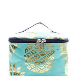 May include: A teal blue zippered cosmetic bag with a gold pineapple print.