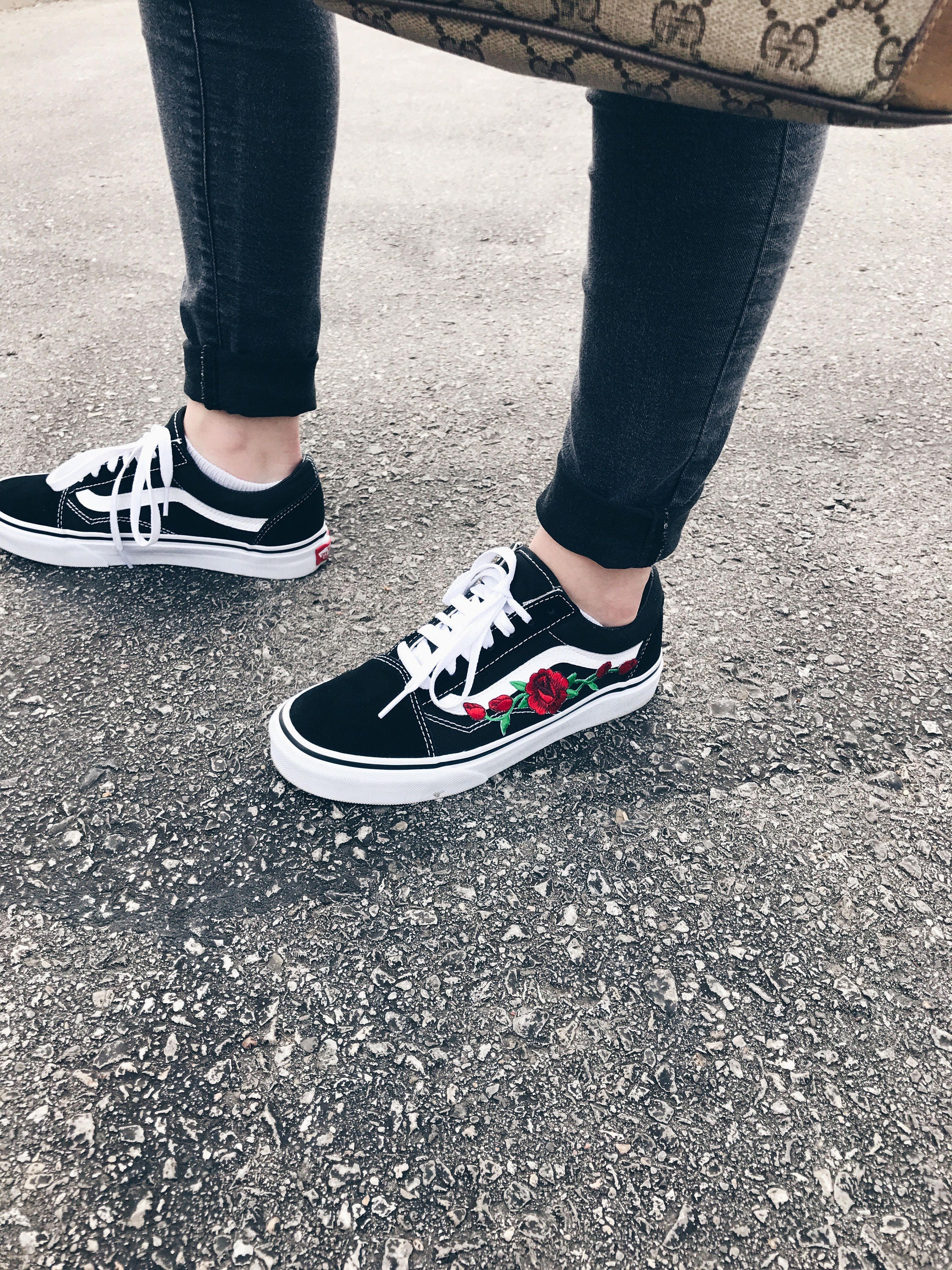 black vans with roses embroidered