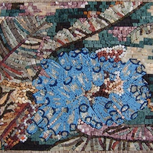 May include: A mosaic artwork featuring a blue flower with white accents surrounded by green and brown leaves.