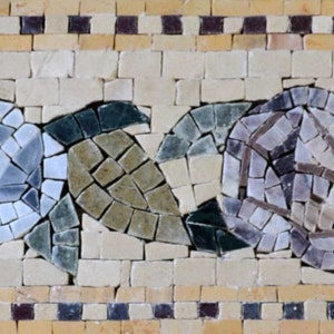 May include: A mosaic tile border with a repeating pattern of stylized flowers and leaves. The flowers are made of white, gray, and purple tiles, while the leaves are made of green and brown tiles.