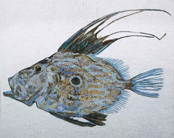 May include: A mosaic artwork depicting a blue and brown fish with a long, thin dorsal fin. The fish is set against a white background.