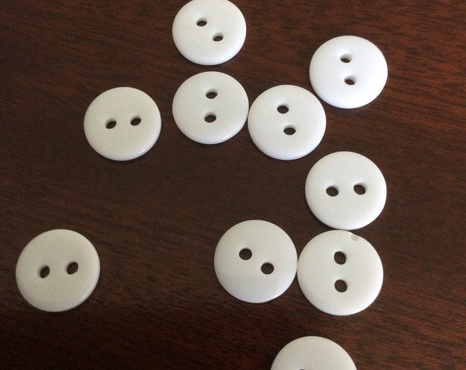 Pack 10 , white plastic  11 mm , 2 hole  buttons Freepost U.K.