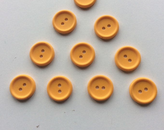 Pack 10 , 15 mm  , egg yolk colour  , 2  hole buttons Freepost uk