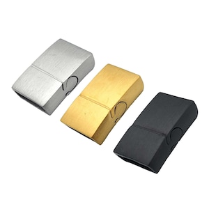 May include: Three magnetic clasps for bracelets or necklaces. The clasps are made of metal and come in silver, gold, and black.